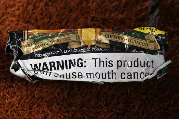 A pouch of chewing tobacco lays on the field before the Cleveland Indians MLB game against the Toronto Blue Jays on May 14, 2014 at Rogers Centre in Toronto, Ontario, Canada. 