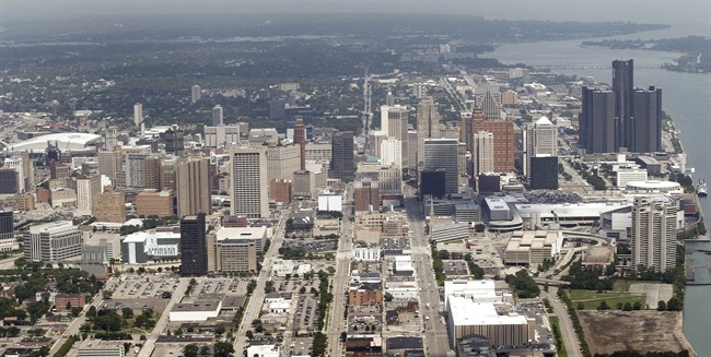 FILE - This July 17, 2013 aerial photo shows the city of Detroit. On Friday, Nov. 7, 2014, federal bankruptcy judge Steven Rhodes is expected to decide whether Detroit's plan to exit bankruptcy is fair and feasible. (AP Photo/Paul Sancya, File).