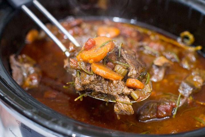 This Nov. 10, 2014, photo shows slow cooker short ribs in Concord, N.H. Slow cookers are a lot different than a generation ago. Many models now let you brown or saute right inside them, which saves the step of having to brown meat or vegetables in a skillet on the stove, then transfer them to a slow cooker.
