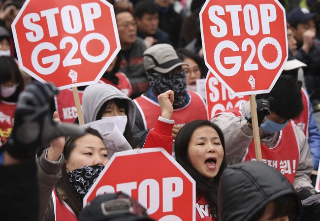 FILE - In this Thursday, Nov. 11, 2010 file photo, protesters gather to denounce the G-20 Summit. Since 2010, the G-20 has issued two-year action plans on anti-corruption efforts, and a report on what has been achieved under the last plan is expected at this weekend's summit. The leaders will also issue a new plan for 2015-16, which is expected to include commitments on issues such as foreign bribery, stolen asset recovery and whistleblower protection, said A.J. Brown, a director with Transparency International Australia. (AP Photo/Wally Santana, File).