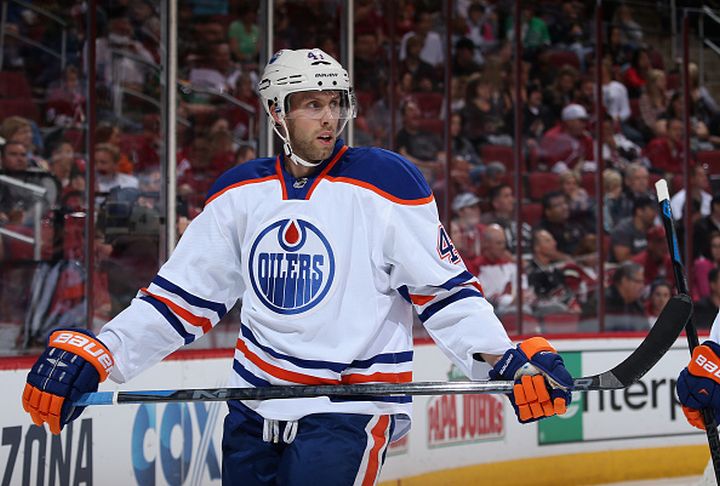 The Edmonton Oilers have acquired centre Kellan Lain from the Vancouver Canucks in exchange for centre Will Acton.
