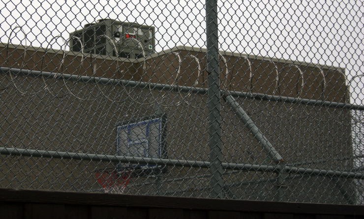 A razor wire fence is seen at the Canada Border Services Agency immigration detention facility on Rexdale Blvd., near Toronto's Person International Airport. 
