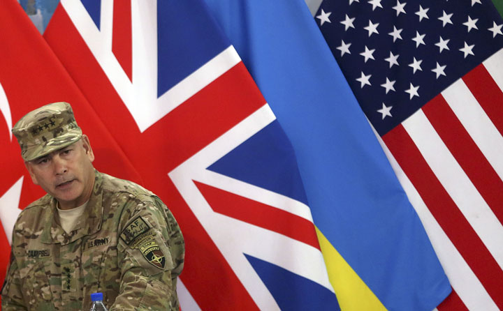 Commander of the International Security Assistance Force Gen. John Campbell speaks during a ceremony to mark the United States and NATO formally ending their war in Afghanistan on Sunday, Dec. 28, 2014 in Kabul.