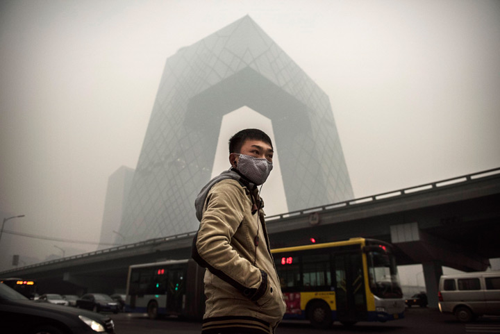 A Chinese man wears a mask in Beijing.