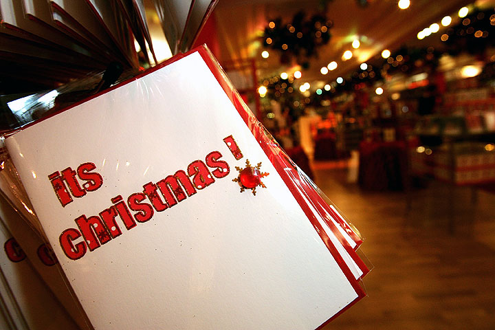 With the ability to send festive greetings electronically, what is the enduring appeal of putting traditional cards in the post?