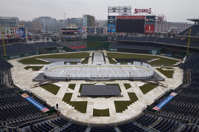 Construction crews work on preparing Nationals Park baseball stadium for the 2015 NHL Winter Classic in Washington on Dec. 22, 2014.