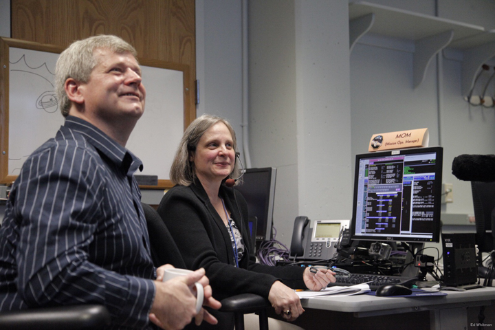 New Horizons Mission Operations Manager Alice Bowman and operations team member Karl Whittenburg watch the screens for data confirming that the New Horizons spacecraft had transitioned from hibernation to active mode on Dec. 6.