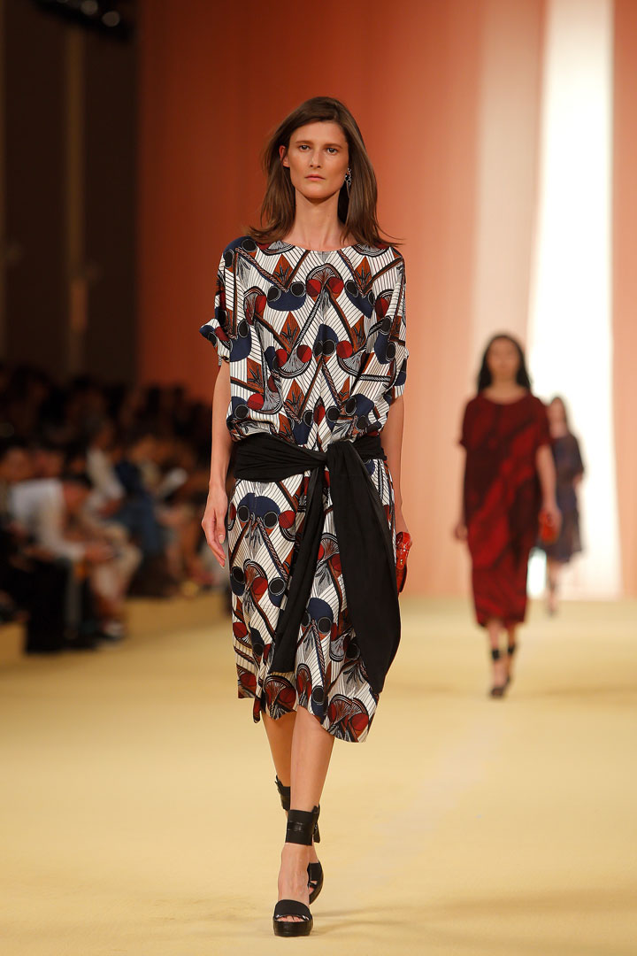 In this Oct. 1, 2014 file photo, a model wears a creation as part of Hermes' Spring/Summer 2015 ready-to-wear fashion collection for Hermes, presented in Paris, France. Marsala, the wine-influenced, red-kissed color of 2015, was chosen by Pantone. Pantone's yearly picks can herald a marked presence of a color in fashion, beauty, housewares, home design and consumer packaging, though some years the influence is stronger than others.