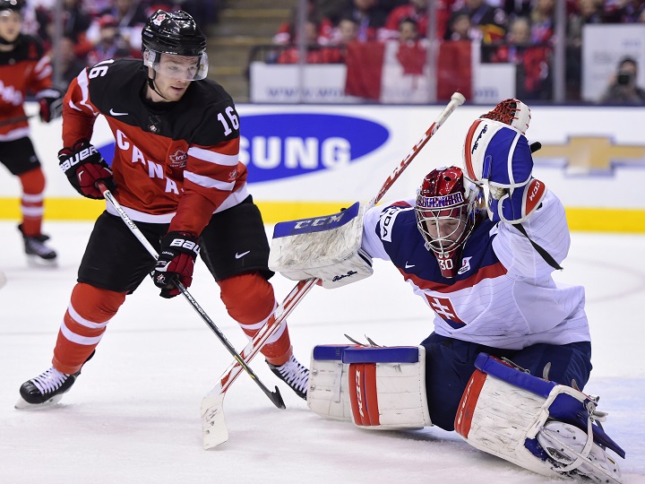 Canada's Max Domi (16) tries to get one past Slovakia's Denis Godla during second period semifinal hockey action at the IIHF World Junior Championship in Toronto on Sunday, Jan. 4, 2015. 