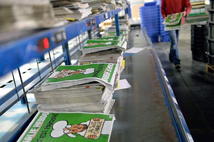 The latest issue of 'Charlie Hebdo,' featuring cartoons by four of the cartoonists killed in the Paris terror attacks, is garnering massive bids on sites like eBay.