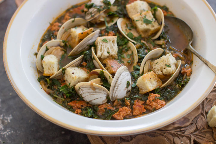 This Jan. 5, 2015 photo shows spicy clam and kale soup in Concord, N.H. Tucked away between the tofu “cheeses” and textured vegetable protein taco crumbles lies a good go-to and good-for-you ingredient, soy chorizo.
