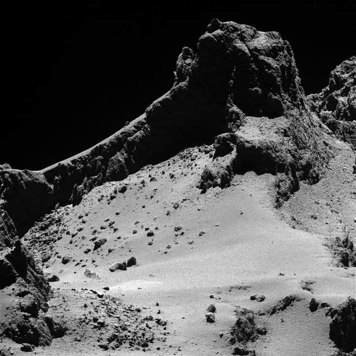 A section of the smaller of Comet 67P/Churyumov–Gerasimenko’s two lobes as seen through Rosetta’s narrow-angle camera from a distance of about 8 km to the surface on 14 October 2014.
