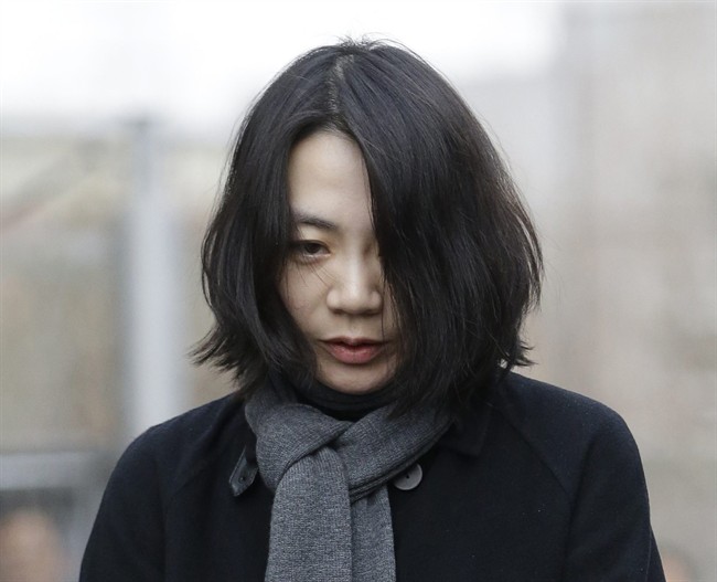 FILE - In this Dec. 12, 2014 file photo, Cho Hyun-ah, who was head of cabin service at Korean Air and the oldest child of Korean Air chairman Cho Yang-ho, speaks to the media upon her arrival for questioning at the Aviation and Railway Accident Investigation Board office of Ministry of Land, Infrastructure and Transport in Seoul, South Korea. 