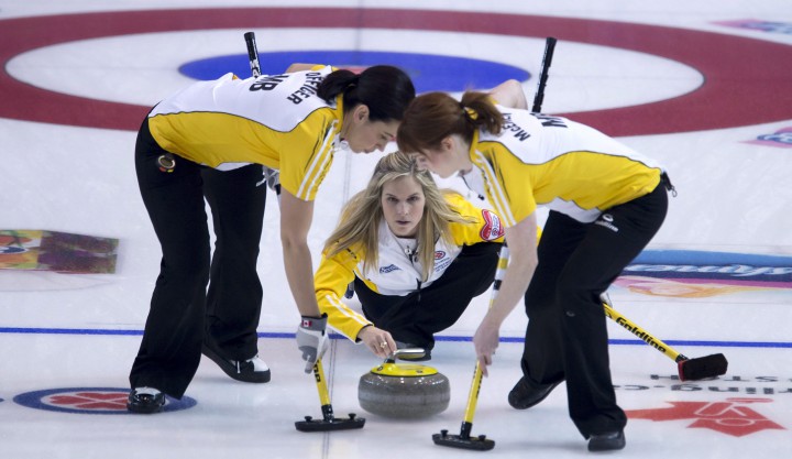 Jennifer Jones watches her shot as Jill Officer, left, and Dawn McEwen sweep at the Canadian women's curling championship last month. They begin world championship play this weekend.