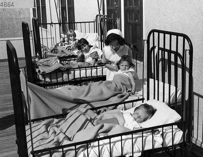 A nurse cares for children with polio at the University Hospital in Edmonton in this undated image.