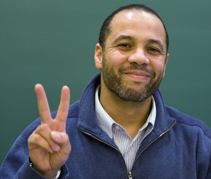 Adil Charkaoui flashes a victory sign at a news conference Wednesday, Oct. 14, 2009 in Montreal. A judge ruled against any apeals to the removal of the security certificate against him and removed all remaining bail conditions against Charkaoui who was suspected of being a terrorist.