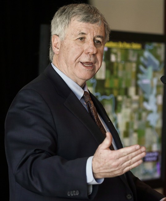 Alberta's finance minister Robin Campbell is expected to deliver more bad news when he presents an update on this year's budget. Campbell in shown in this Tuesday, April 29, 2014 file photo.