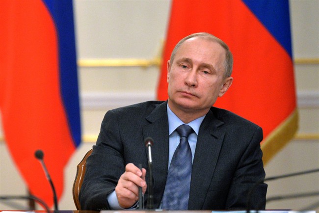 Russian President Vladimir Putin listens during the State Council meeting in the Novo-Ogaryovo residence, outside Moscow, Russia, Tuesday, Feb. 24, 2015. 