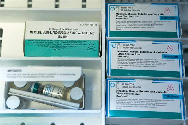 This Thursday, Jan. 29, 2015 file photo shows boxes of the measles, mumps and rubella virus vaccine (MMR) and measles, mumps, rubella and varicella vaccine inside a freezer at a doctor's office in Northridge, Calif.