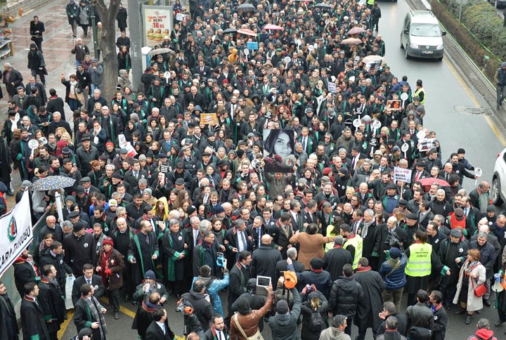 Members of Turkey’s Bar Associations hold a poster depicting slain Ozgecan Aslan, in Ankara, on February 16, 2015 during a march to protest against a law that strengthens the police’s power.