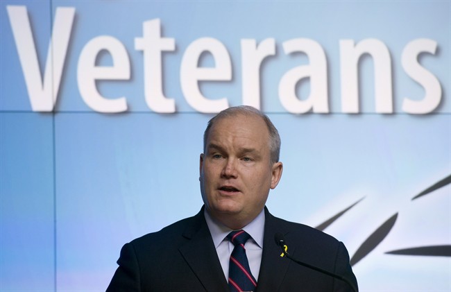 Minister of Veterans Affairs Erin O'Toole speaks during a news conference at the Department of National Defence headquarters in Ottawa on Monday March 30, 2015.