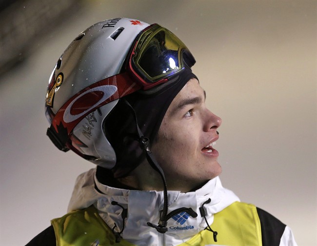 Mikael Kingsbury of Canada waits after his run during the men's freestyle skiing World Cup dual moguls Saturday, Jan. 10, 2015, in Park City, Utah.