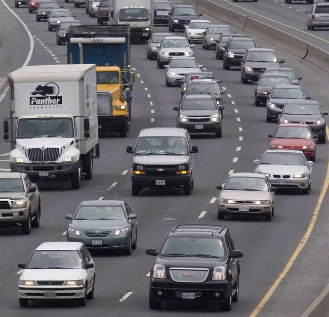 Traffic moves along a congested highway in Toronto, on April 26, 2007.