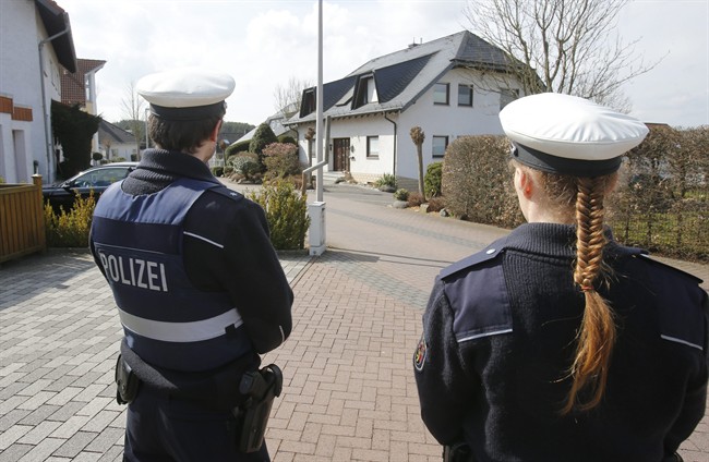 Police stand guard outside the house where Andreas Lubitz is believed to have lived in Montabaur, Germany, on Thursday, Mar. 26, 2015.