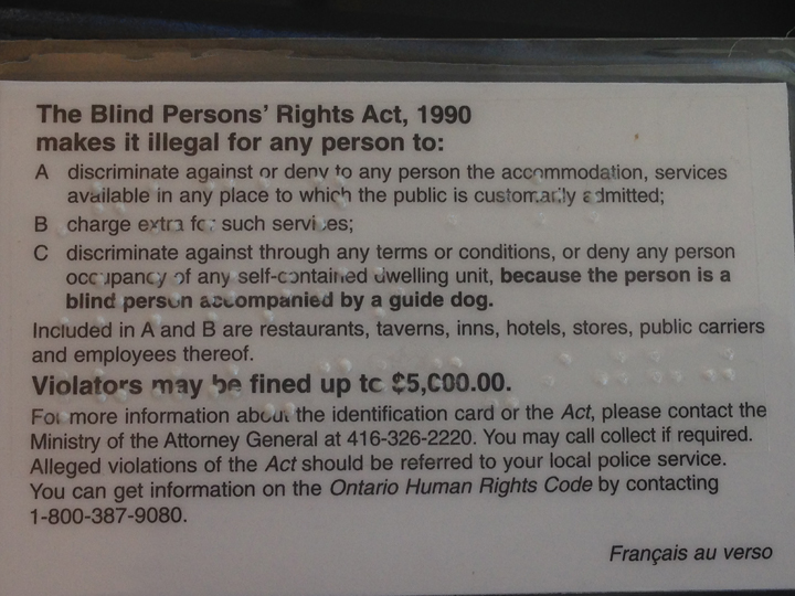 The back of Diane Bergeron's card explaining that police are supposed to investigate when she is denied service.
