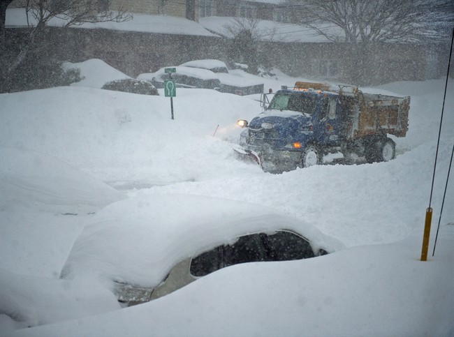 A snowplow clears a residential street in Dartmouth, N.S. on Wednesday, March 18, 2015.
