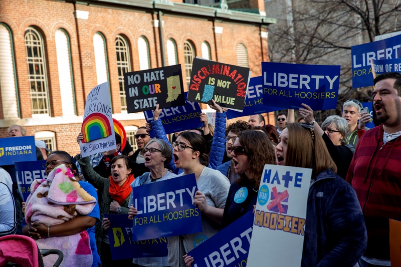 Demonstrators gather outside the City County Building on March 30, 2015 in Indianapolis, Indiana. The group called on the state house to roll back the controversial Religious Freedom Restoration Act, which critics say can be used to discriminate against gays and lesbians.