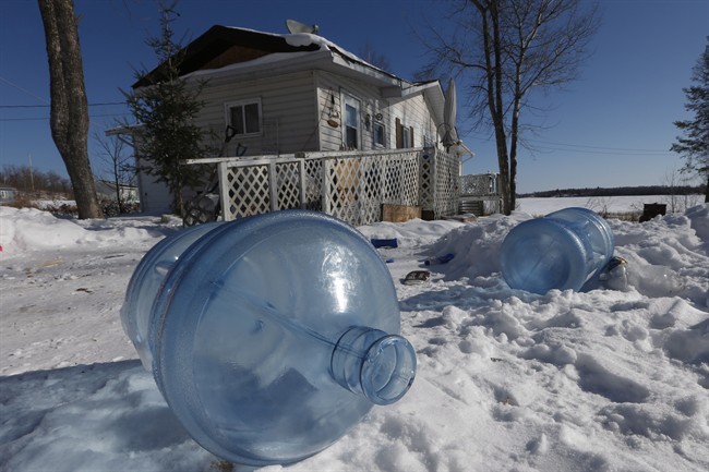 Empty 20 litre water bottles sit outside Laura Green's house waiting for pickup and refilling Wednesday, February 25, 2015. The Shoal Lake community, despite supplying water to the city of Winnipeg, is under a boil water advisory and lacks year round road access.