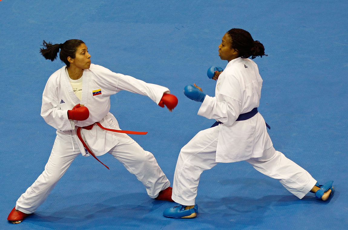 Cheryl Murphy of the USA (Blue) fights Yoly Guillen of Venezuela during a Karate match during Day 14 of the XVI Pan American Games at the San Rafael Parks Sports Complex on October 28, 2011 in Guadalajara, Mexico.