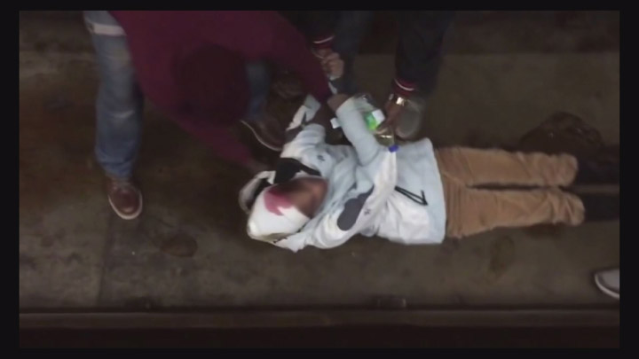 A still from a video shot at Montreal’s Jarry metro station that shows three men saving a woman who was on the tracks is going viral after it was posted on social media.