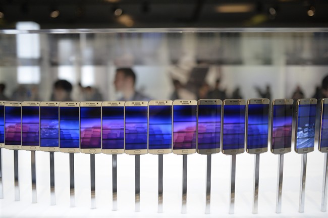  In this March 1, 2015 file photo, the new Galaxy S6 and S6 Edge phones are displayed during a Samsung Galaxy Unpacked 2015 event.