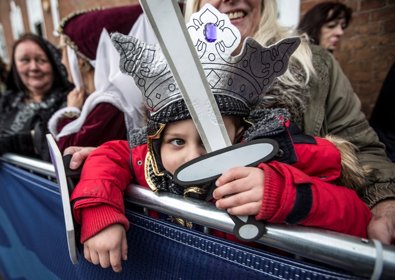 Four year old Torin Weston from Leicester, dressed as Richard III waits with his grandmother outside Leicester Cathedral for the reinterment ceremony of King Richard III, on March 26, 2015 in Leicester, England. The skeleton of King Richard III was discovered in 2012 benaeth a car park, in the foundations of Greyfriars Church in Leicester, 500 years after he was killed in the Battle of Bosworth Field.