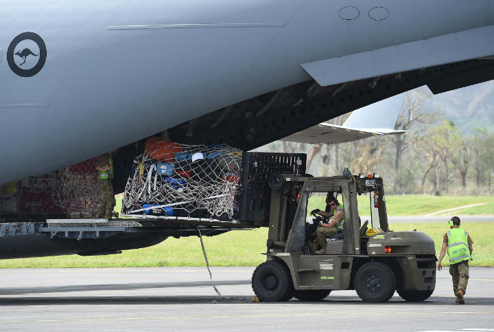 An Australian RAAF C-17 Globemaster containing aid is unloaded on March 16, 2015 in Port Vila, Vanuatu. Cyclone Pam has hit South Pacific islands on Saturday with hurricane force winds, huge ocean swells and flash flooding and has caused severe damage to housing. Aid agencies say it could be one of the worst disasters ever to hit the region.