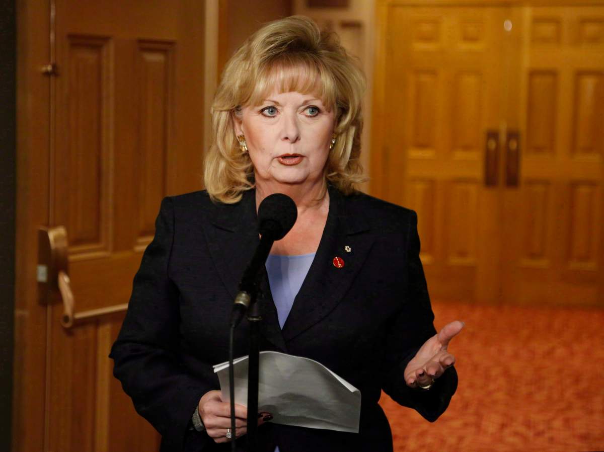 Pamela Wallin speaks to reporters outside a Senate committee hearing on Parliament Hill in Ottawa on Monday, August 12, 2013. THE CANADIAN PRESS/ Patrick Doyle.