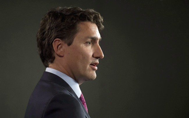Liberal Leader Justin Trudeau speaks with the media following caucus Wednesday March 25, 2015 in Ottawa. 