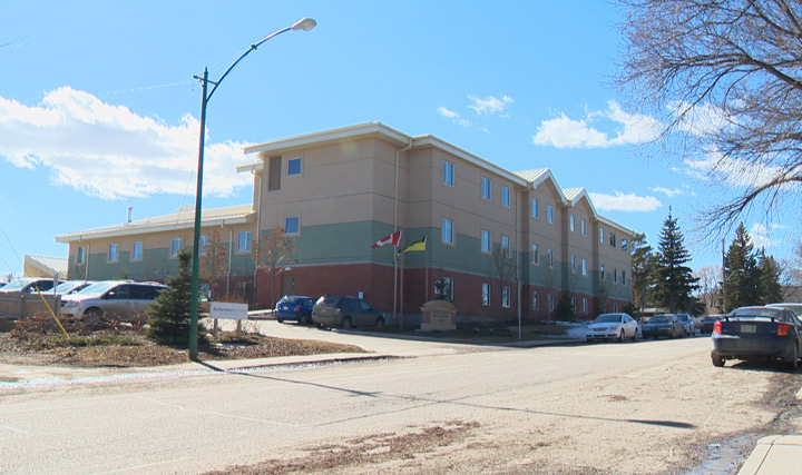 A care aide worker at Saskatoon's Oliver Lodge suspended with pay says it's because he spoke out; officials say it's unrelated to his public comments.