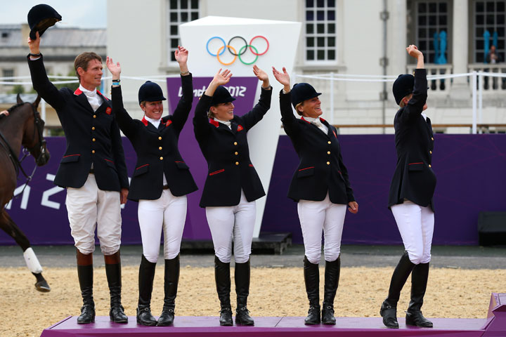 The Great Britain team celebrate on the podium after winning the Silver medal in the Eventing Team Jumping Final Equestrian event on Day 4 of the London 2012 Olympic Games at Greenwich Park on July 31, 2012 in London, England.