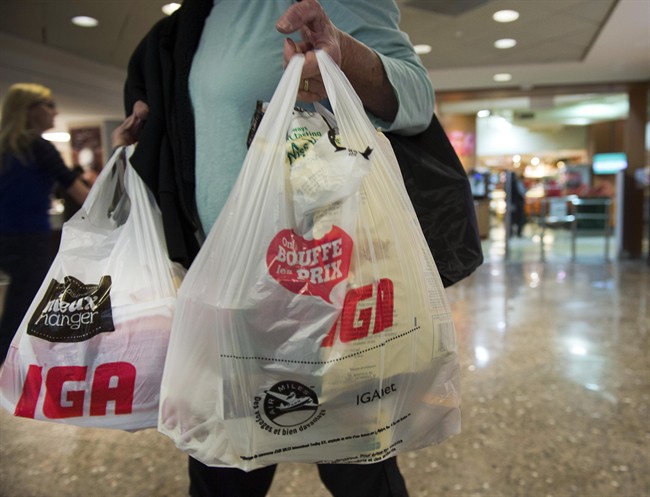A woman leaves a grocery store Friday, May 15, 2015 in Montreal.