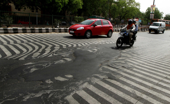 NEW DELHI, INDIA - MAY 24: A road melt near Safdarjung Hospital after the Temperature rise to 45 degree Celsius during a hot weather as Delhi/NCR experienced yet another scorching day, on May 24, 2015 in New Delhi, India. The national capital sizzling today as heat wave-like conditions prevailed across the city with mercury hovering above 45.3 degree Celsius, making life tough for the Delhiites. (Photo by Sanjeev Verma/Hindustan Times via Getty Images)
