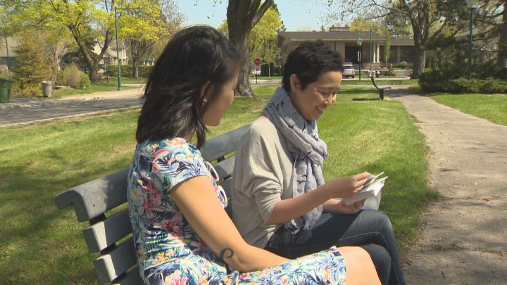 Mai Duong shows Global reporter Rachel Lau photos of her daughter, Alice.