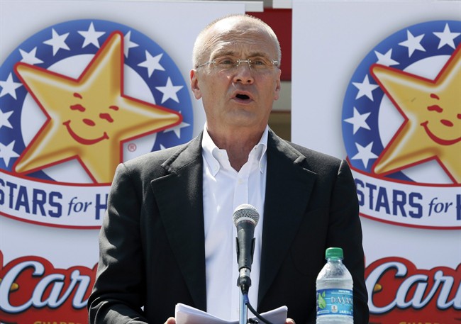 In this Aug. 6, 2014 photo provided by CKE Restaurants, company CEO Andy Puzder speaks at a news conference in Austin, Texas, to highlight Carl’s Jr.’s commitment to the state.