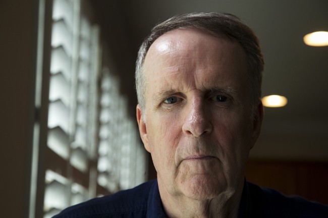 John Ryan poses for a picture in his house in Aldie, Va., Friday, May 29, 2015. For the first time, a major study has shown that a drug targeting the body's disease-fighting immune system may improve survival for the most common form of lung cancer.
