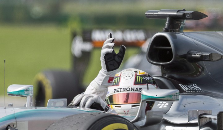 Lewis Hamilton from Great Britain salutes the crowd after winning the Canadian Grand Prix in Montreal, Sunday, June 7, 2015.