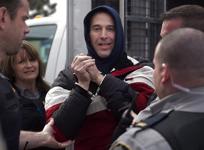 Christopher Phillips, accused of threatening police with a dangerous chemical, arrives for his bail hearing at provincial court in Dartmouth, N.S. on Tuesday, March 17, 2015.