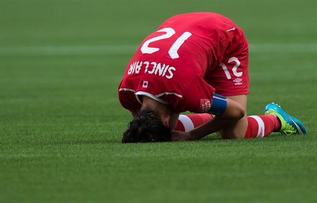 Canada's Christine Sinclair reacts after losing 2-1 to England during a FIFA Women's World Cup quarter-final soccer game in Vancouver on June 27, 2015.