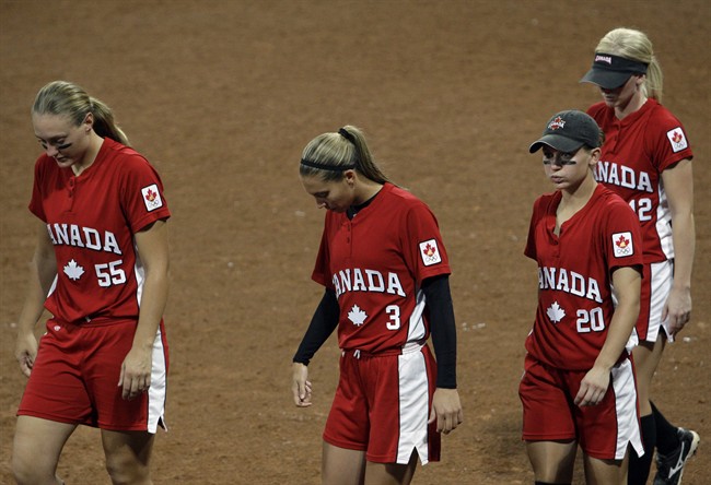 Canada players (from left) Kaleigh Rafter, Lauren Bay Regula, Erin McLean and Melanie Matthews leave the field after losing to Japan in a softball game in the Beijing 2008 Olympics in Beijing, Monday, Aug. 18, 2008.